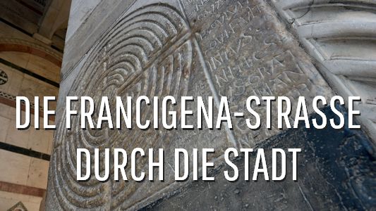 Schaltfläche an der Seite Die Francigena Srtasse fuehrt durch die Stadt